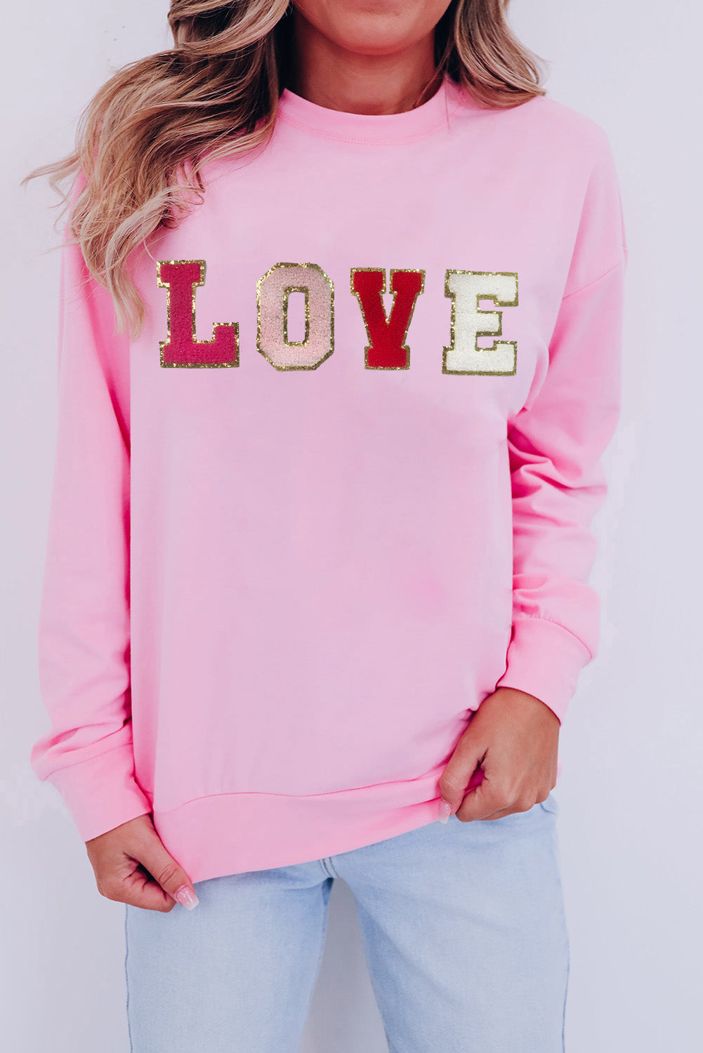 Love Never Fails Glitter Patch Sweatshirt